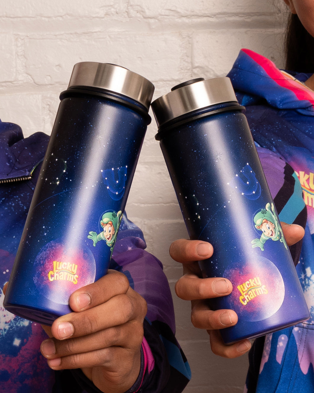 Two hands holding 2 Lucky Charms™ colorful cosmic stainless steel water bottles.