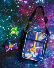 Lucky Charms™ Cosmic Cross Body Bag, pouch and keychain in front of an outer space background.
